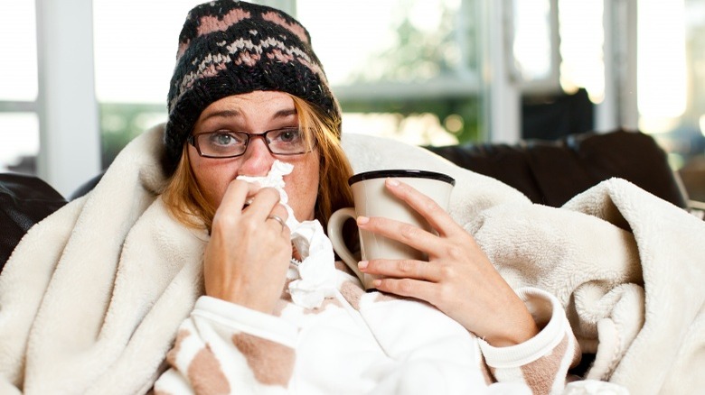 weak immune system sick woman cold and flu