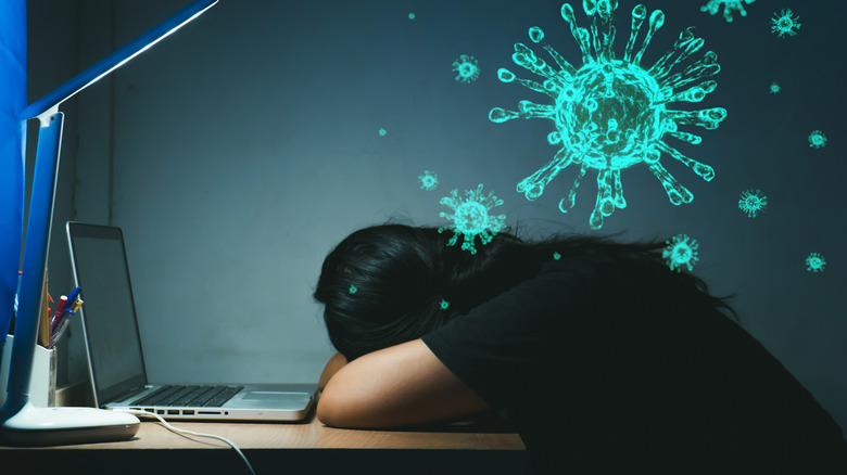 Girl sleeping at computer desk