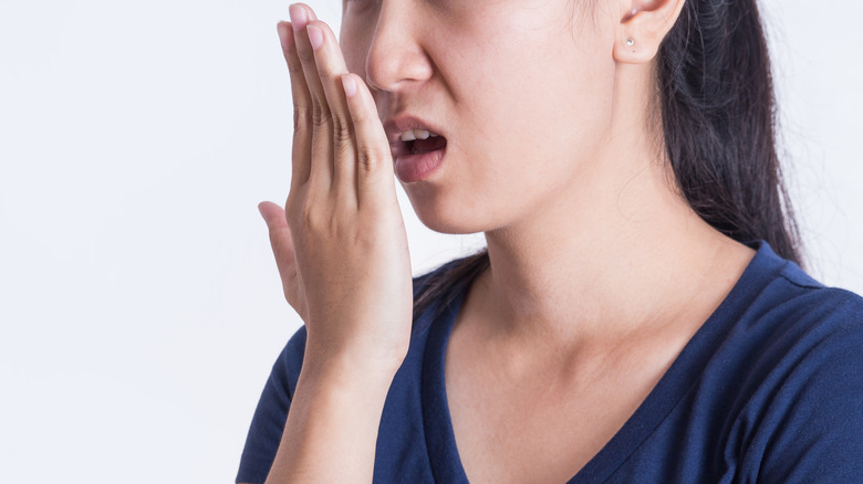 woman checking breath