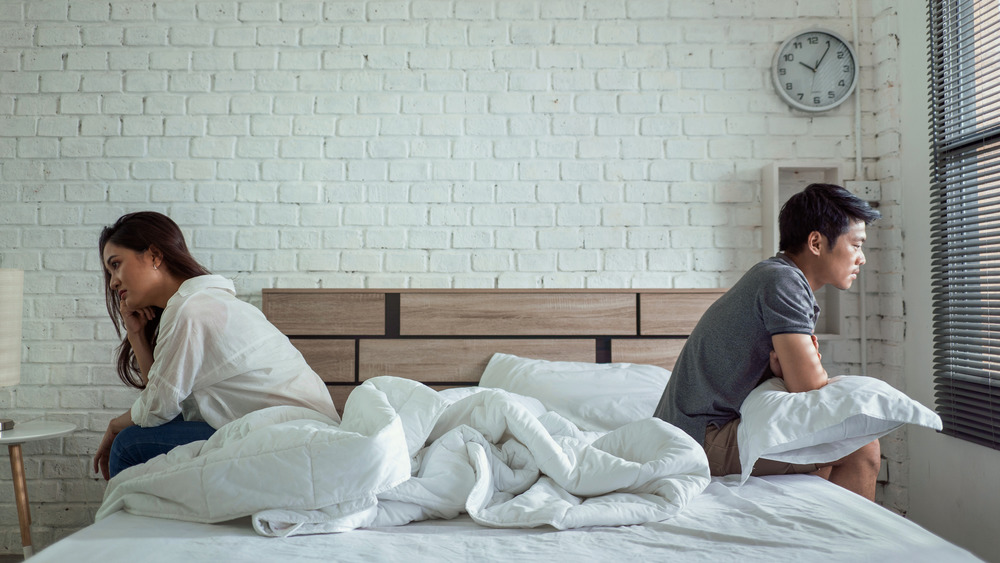 couple sitting on a bed