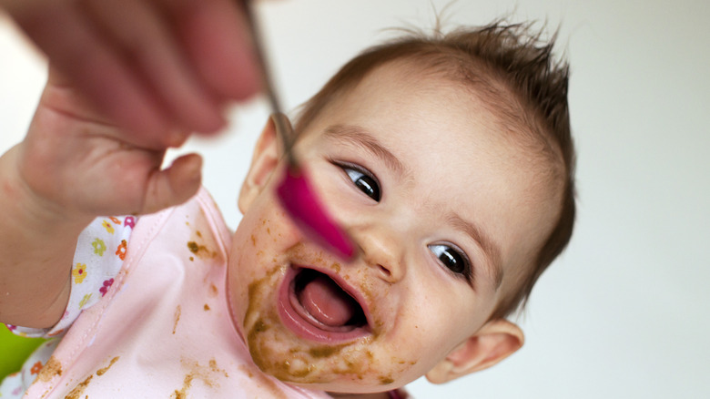 Baby eating messy food