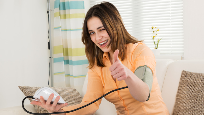 woman in love checking blood pressure