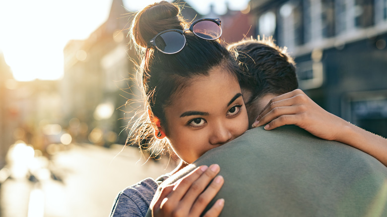 Woman in love hugging partner