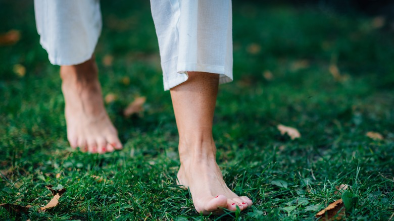 feet walking on grass