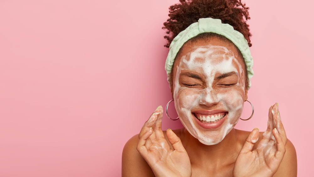 A woman washing her face