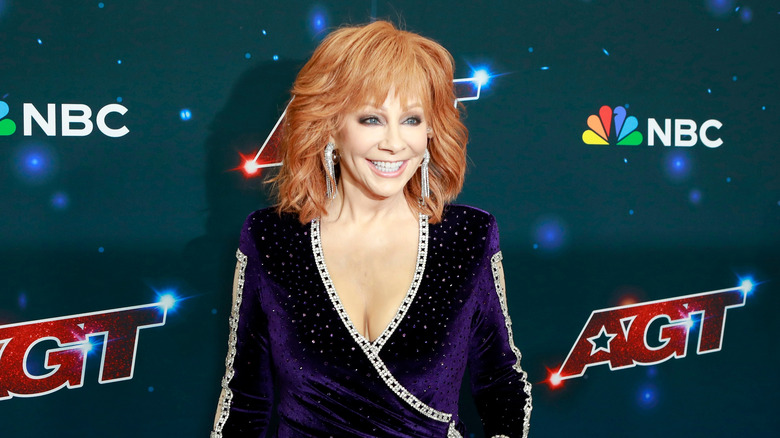 Reba McEntire smiles at the America's Got Talent Season Fantasy League Photo Call on September 20, 2023 in Pasadena, CA