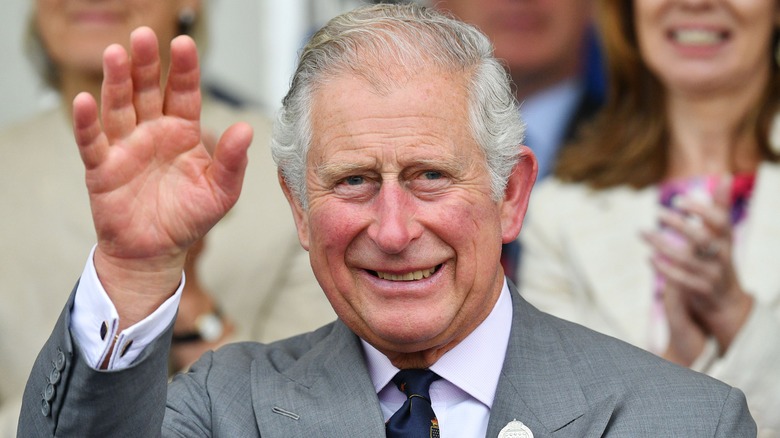 King Charles III waving