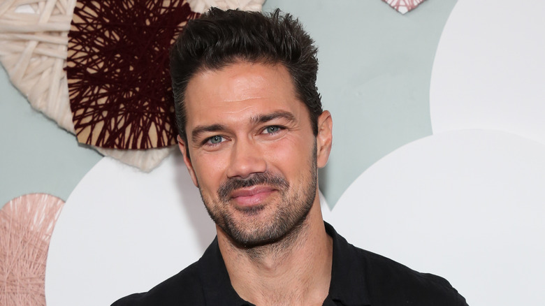 Ryan Paevey smiles at a preview