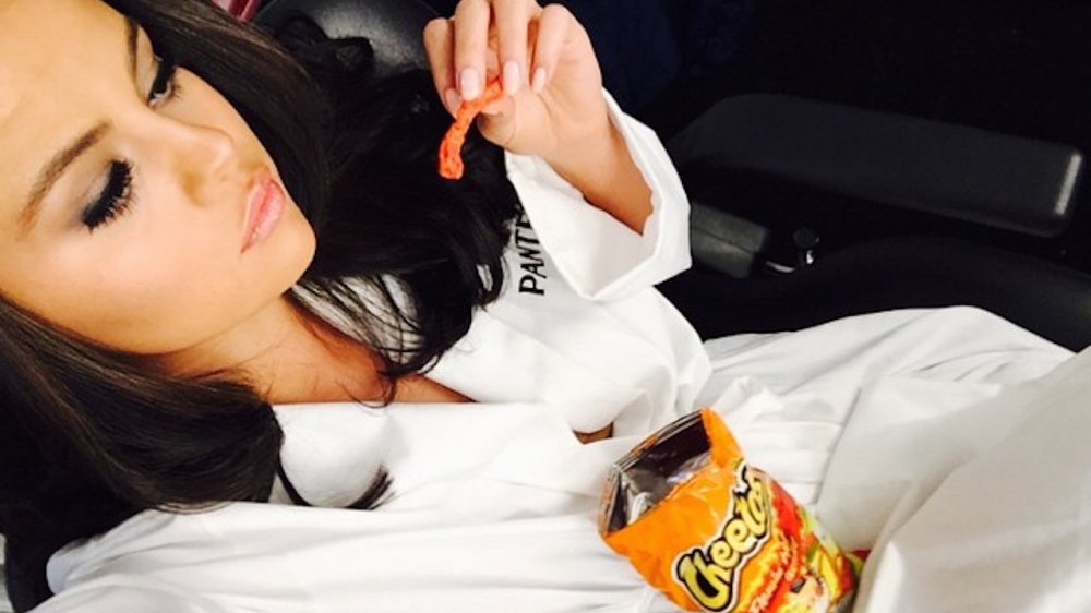 Selena Gomez eating Cheetos