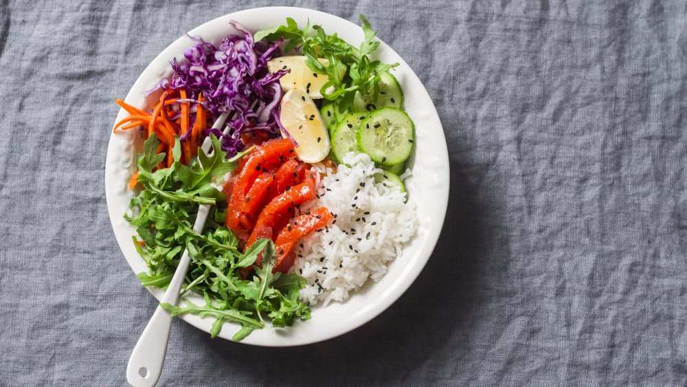 A protein bowl with salmon, rice, and veggies