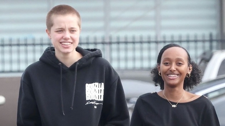 Shiloh Jolie-Pitt and Zahara Marley Jolie walking