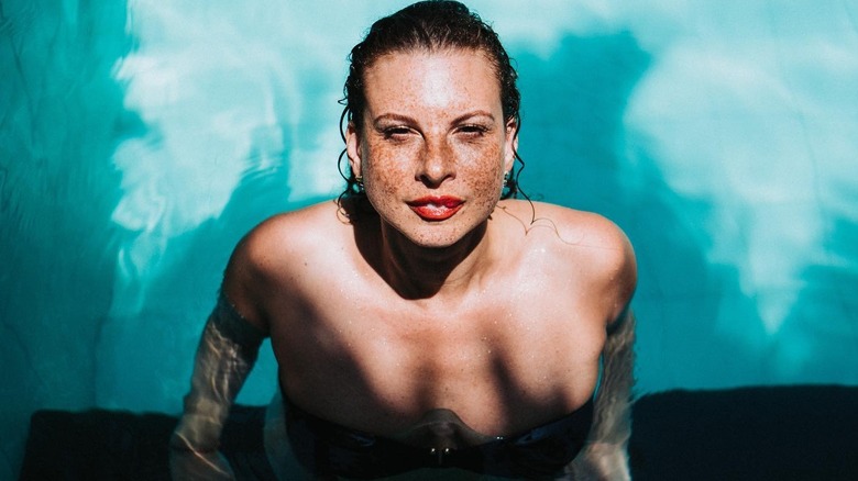 Freckled woman in pool