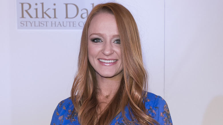 Maci Bookout poses on the red carpet