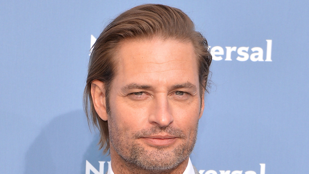 Josh Holloway smiling on red carpet