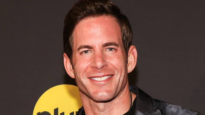 Tarek El Moussa smiling and looking straight