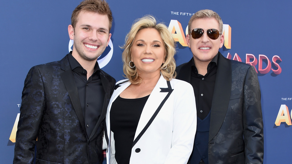 Chase Chrisley, Julie Chrisley, and Todd Chrisley on the red carpet in 2018