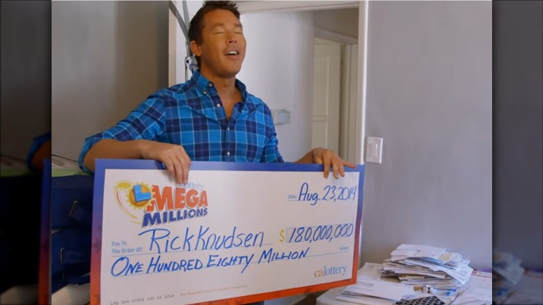 David Bromstad holding winning check