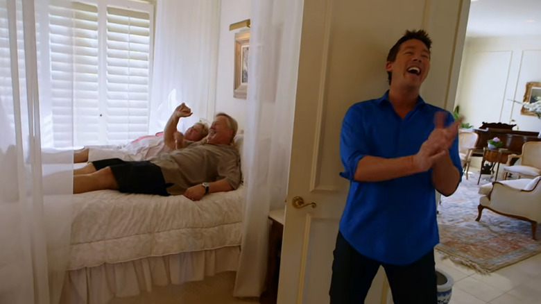 Winners on bed, David Bromstad laughing