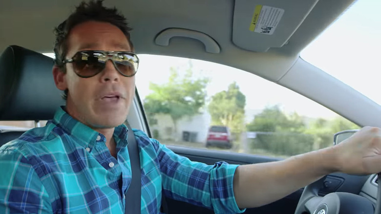 David Bromstad in sunglasses, driving