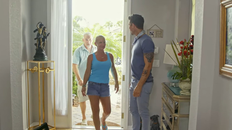 Couple, David Bromstad entering a house