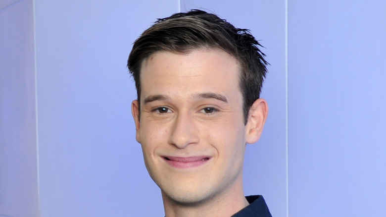 Tyler Henry on purple background