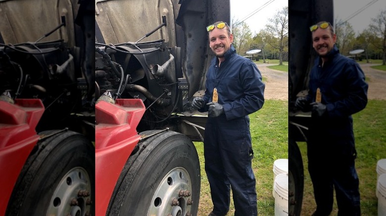 Abe Schmucker smiling next to truck