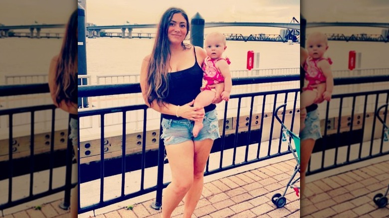 Sabrina Burkholder poses with daughter