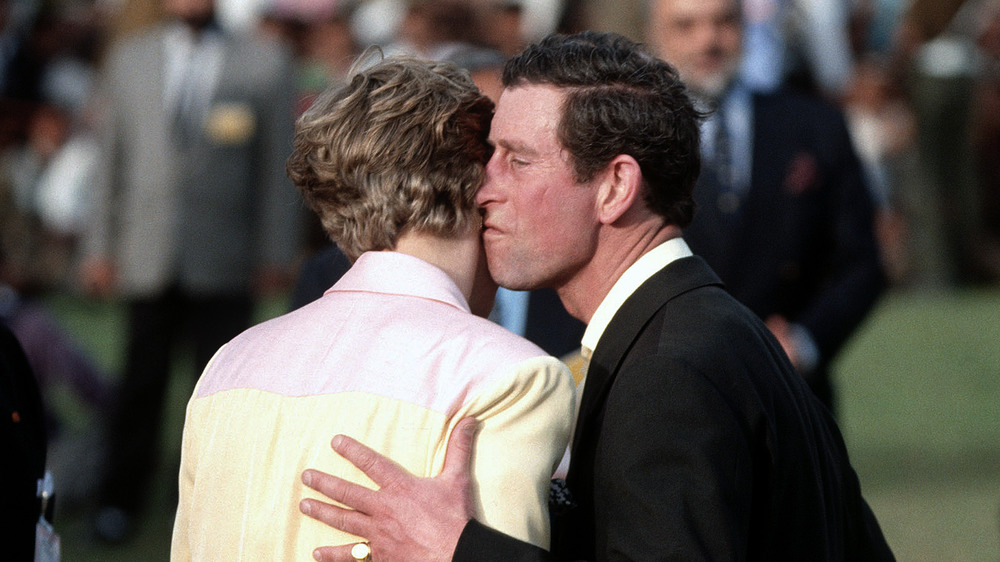 Prince Charles kissing Princess Diana on the cheek
