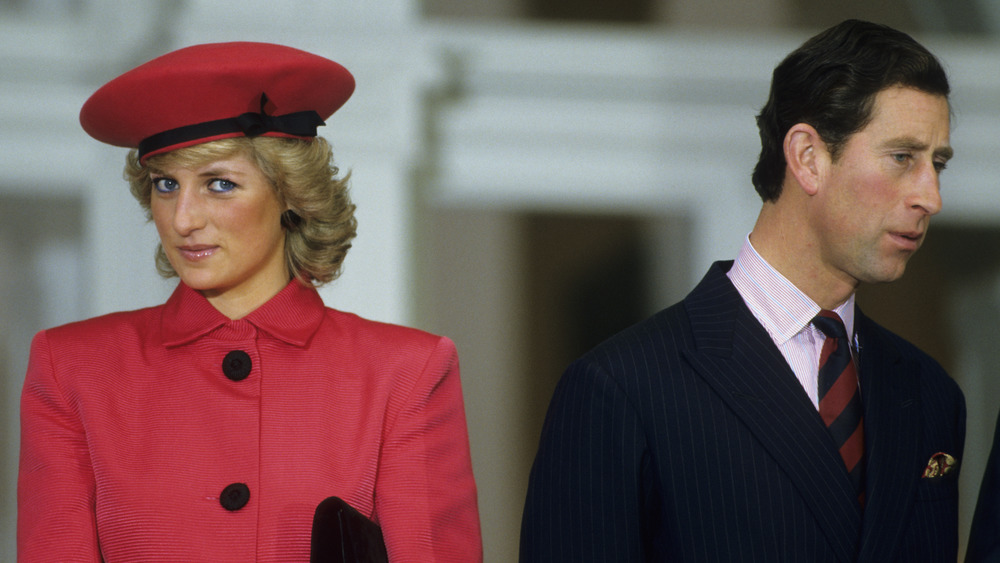 Princess Diana and Prince Charles, looking in different directions