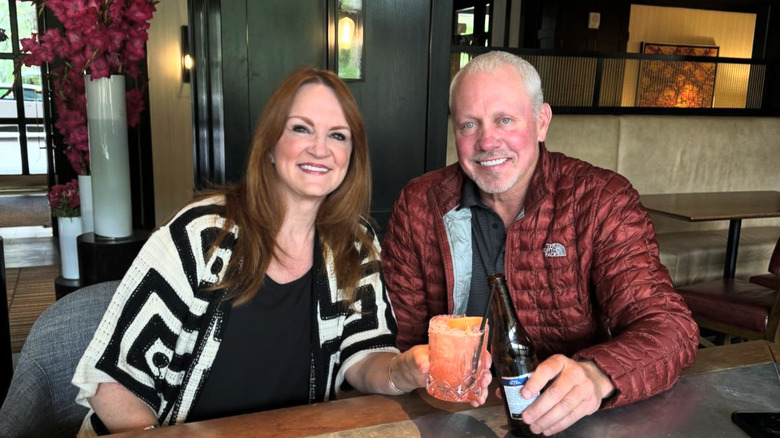 Ree Drummond and husband Ladd sharing an appetizer at a restaurant