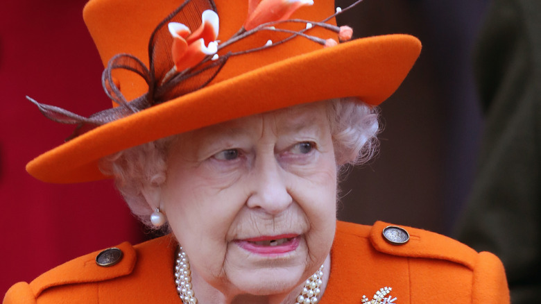 Queen Elizabeth in orange outfit