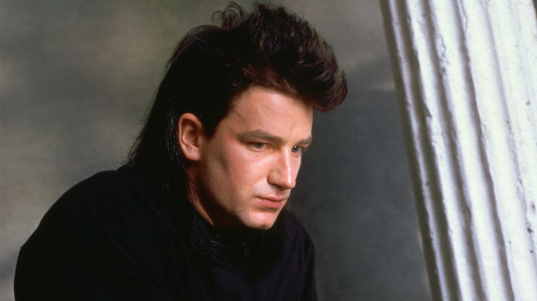 Young Bono looking deep in thought