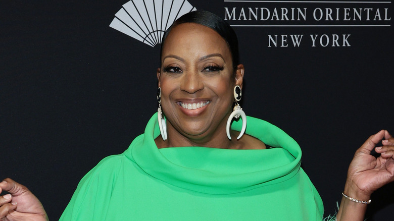 Star Jones smiling and posing