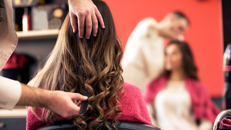 Woman getting hair done at a salon