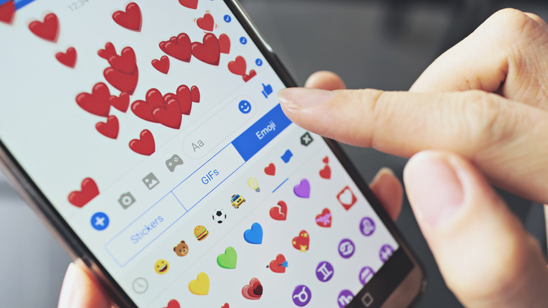 Phone screen with heart emojis