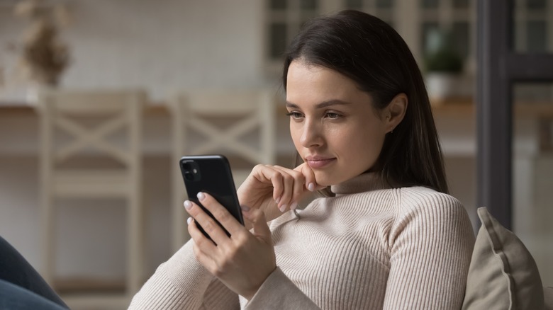 woman thinking on phone