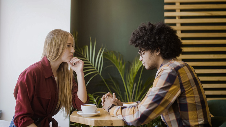 couple talking at a cafe