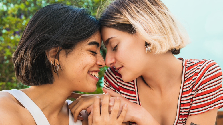 two women holding hands