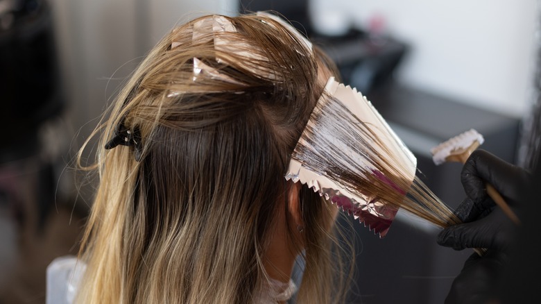 hair covered in foil during dying