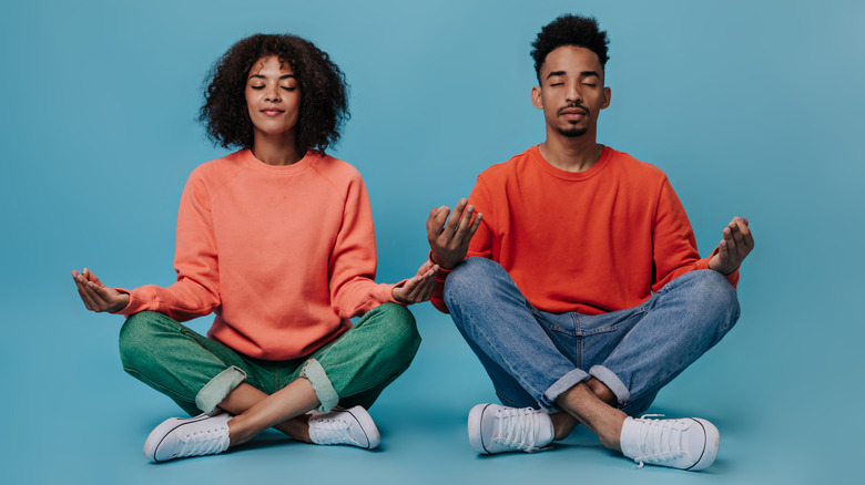 Two people meditating 