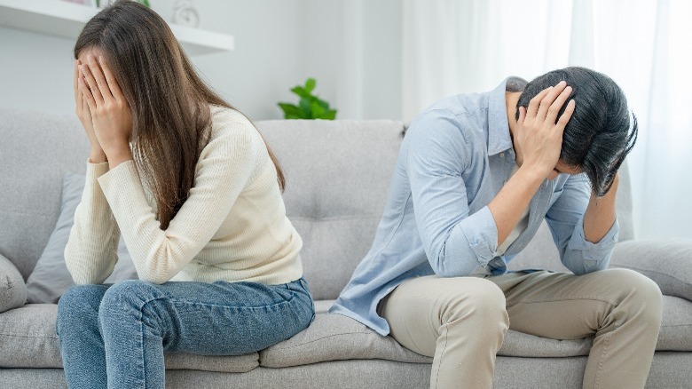 Couple in distress on the couch