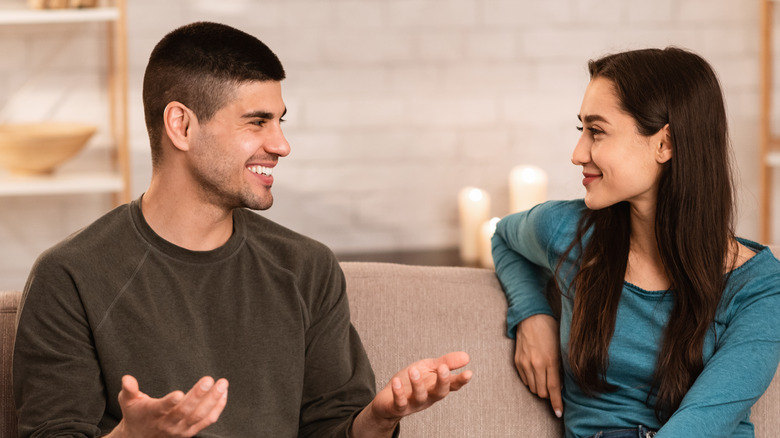 Man talking to woman