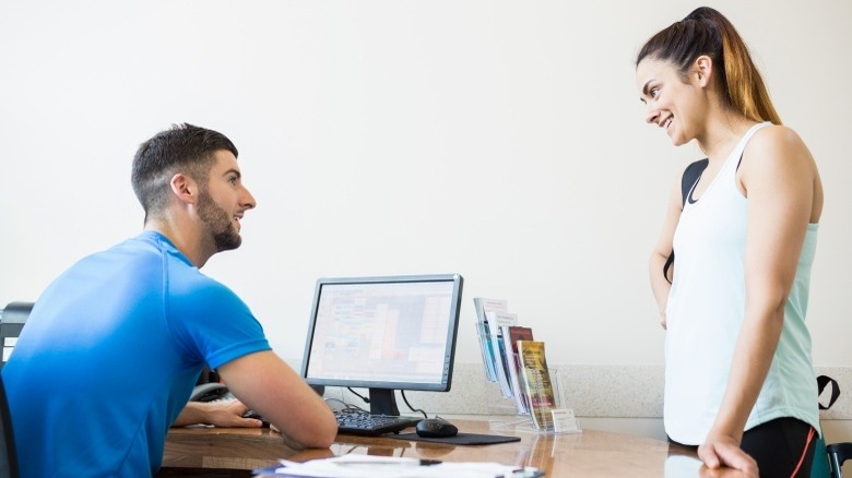 woman talking to trainer