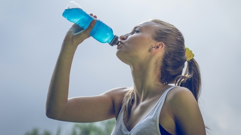 woman drinking sports drink