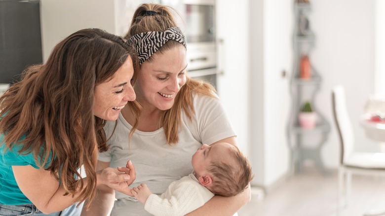 Women smiling with baby 