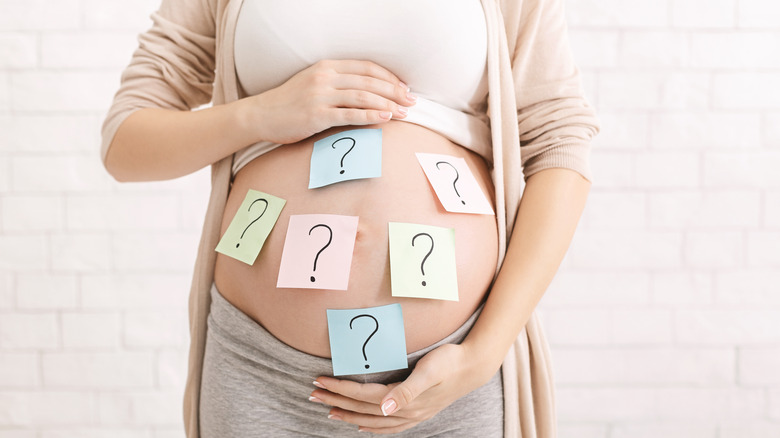 Pregnant woman's question marks 