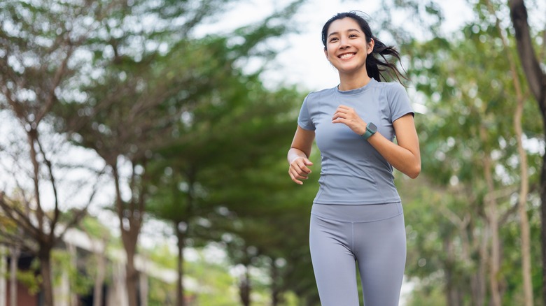 Smiling woman jogging 