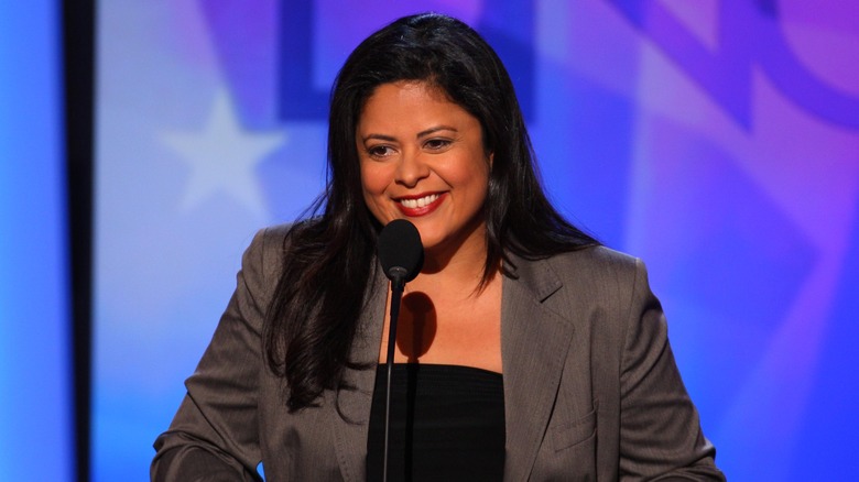 Maya Soetoro-Ng smiling and delivering a speech