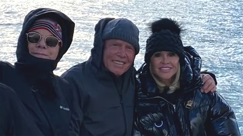 Don Hankey poses with wife and friend on yacht