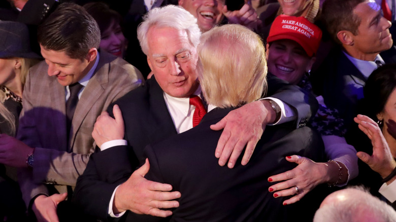 Robert Trump hugs Donald Trump